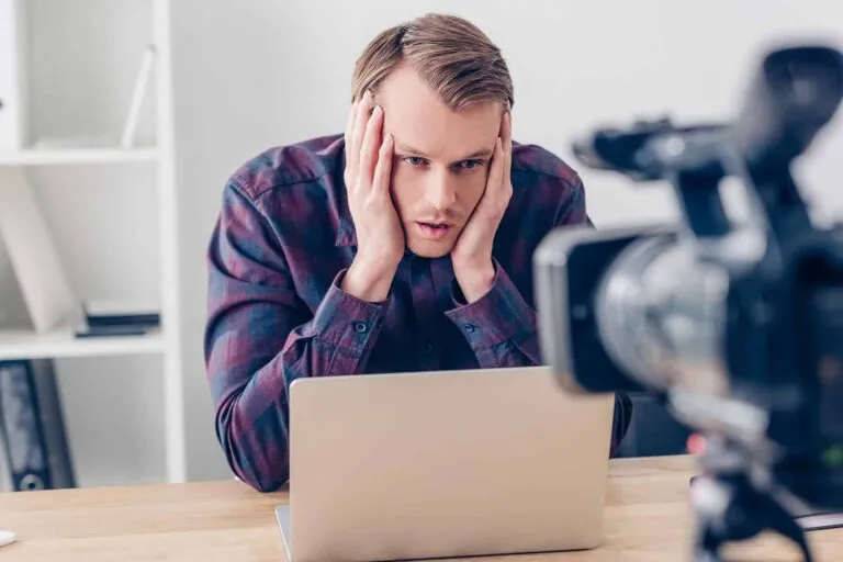 tired-handsome-male-video-blogger-touching-head-an-2024-11-10-09-45-43-utc (1)